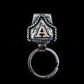 Handmade metal cow tag belt key holder keychain shown in one of twenty-six available colours, featuring a keyring and attached belt hook.