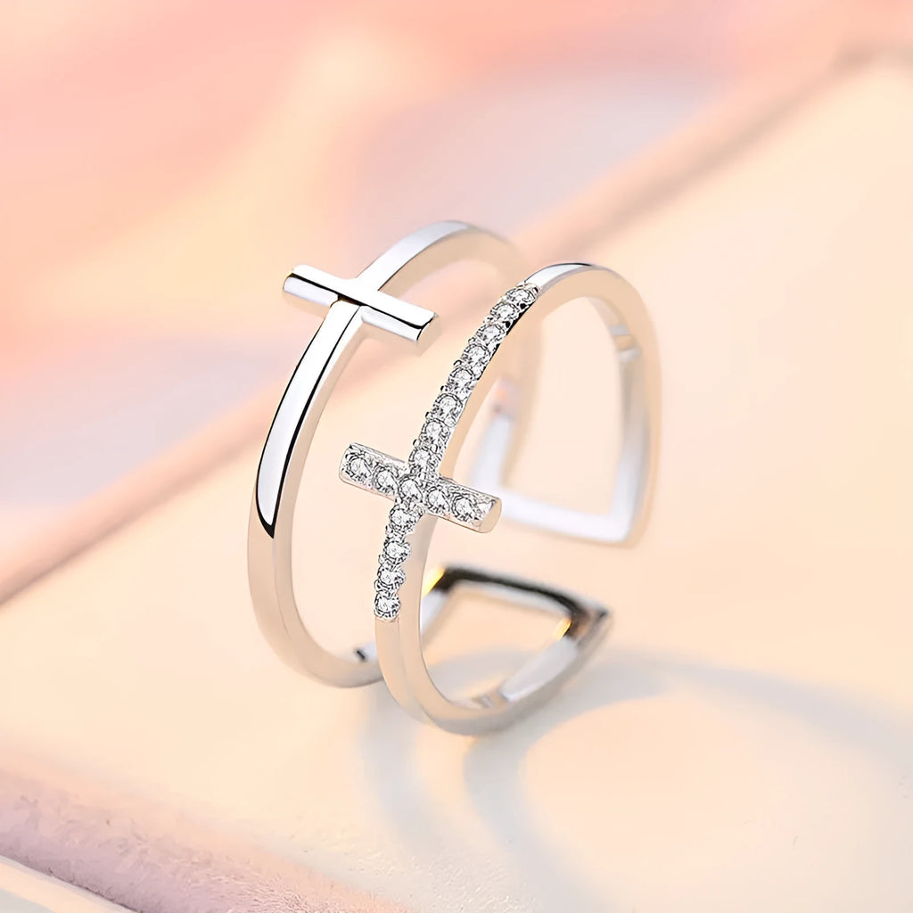 Women's adjustable copper ring with a double cross design and sparkling zircon inlays.