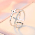 Women's adjustable copper ring with a double cross design and sparkling zircon inlays.