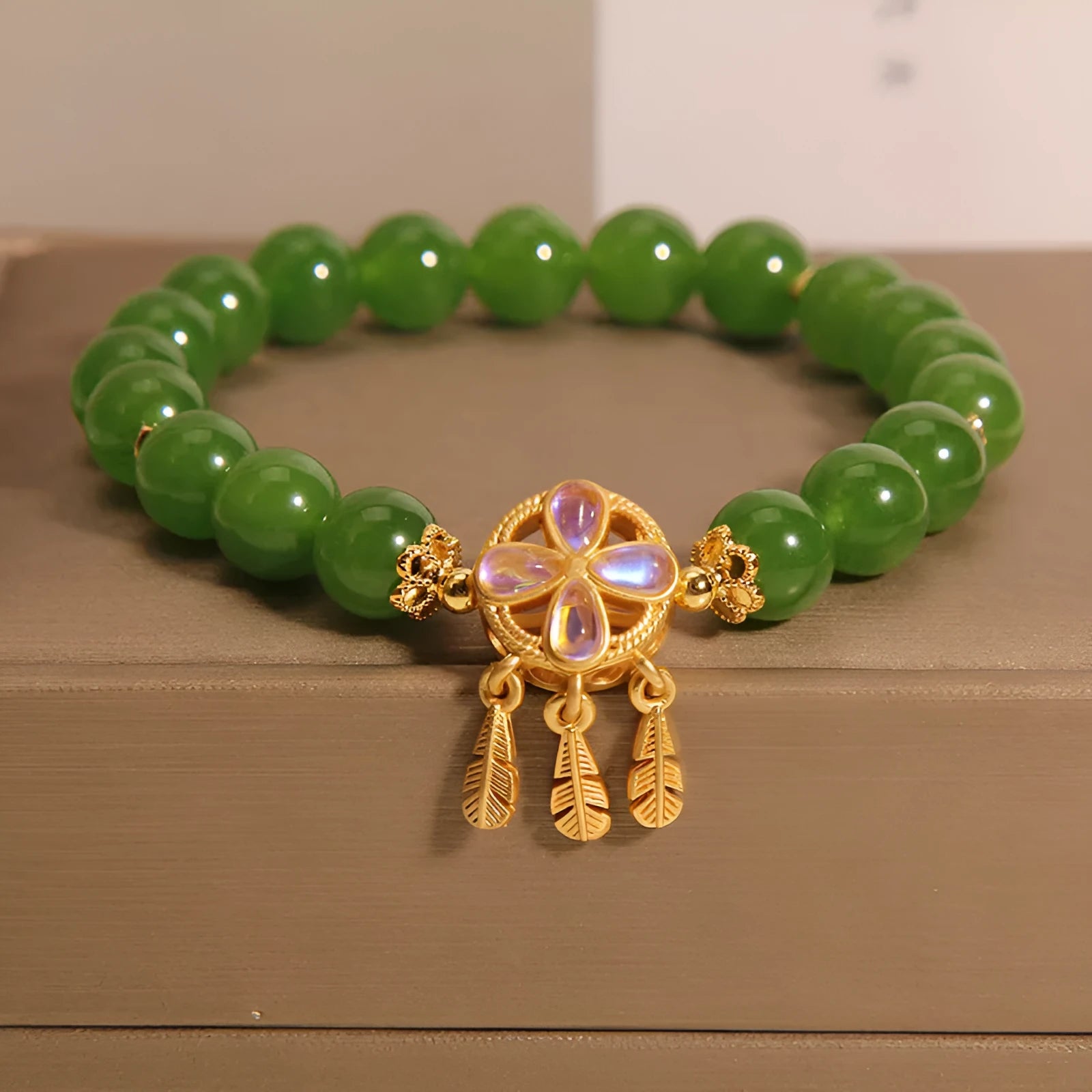 Green jasper crystal bracelet for women with four-leaf clover dream catcher pendant.