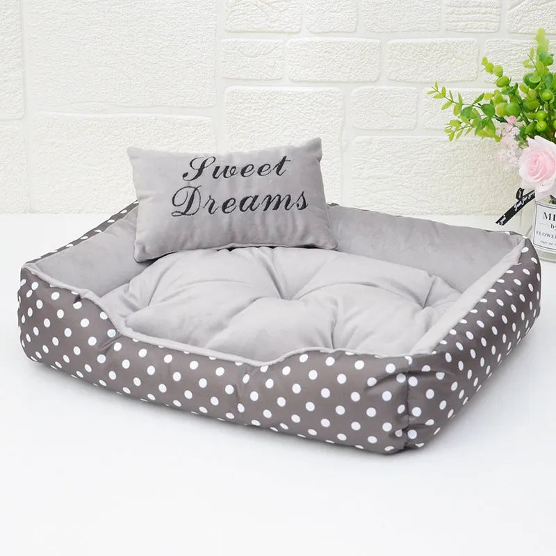 Polka dot printed square small dog bed with matching embroidered pillow in grey, blue, pink, or red colours.