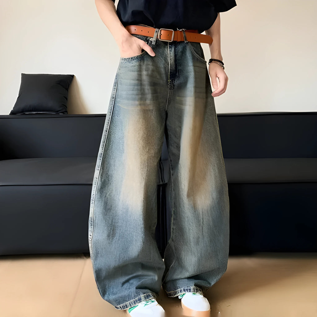 Men's retro blue distressed jeans with machete wash pattern and wide-leg design