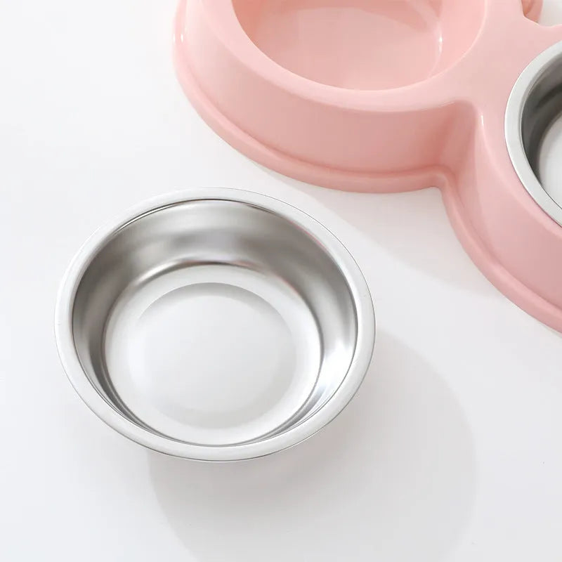 Blue stainless steel double bowl pet feeder with frog-shaped centrepiece for cat or dog food and water.
