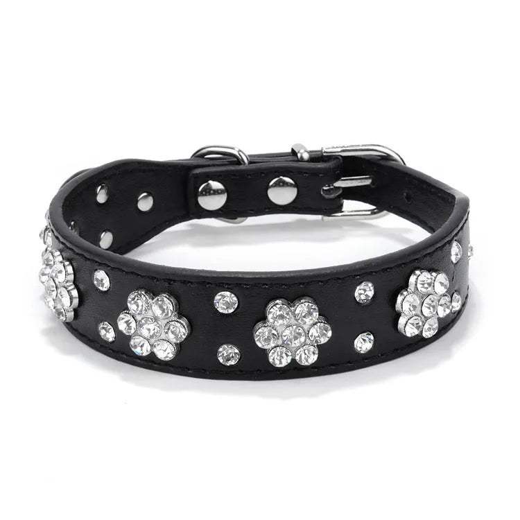 PU leather dog collar with rhinestone flower pattern and metal D-ring on a white background