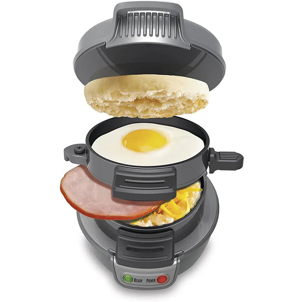 Bright red breakfast sandwich maker with egg cooker ring and baking trays on kitchen counter