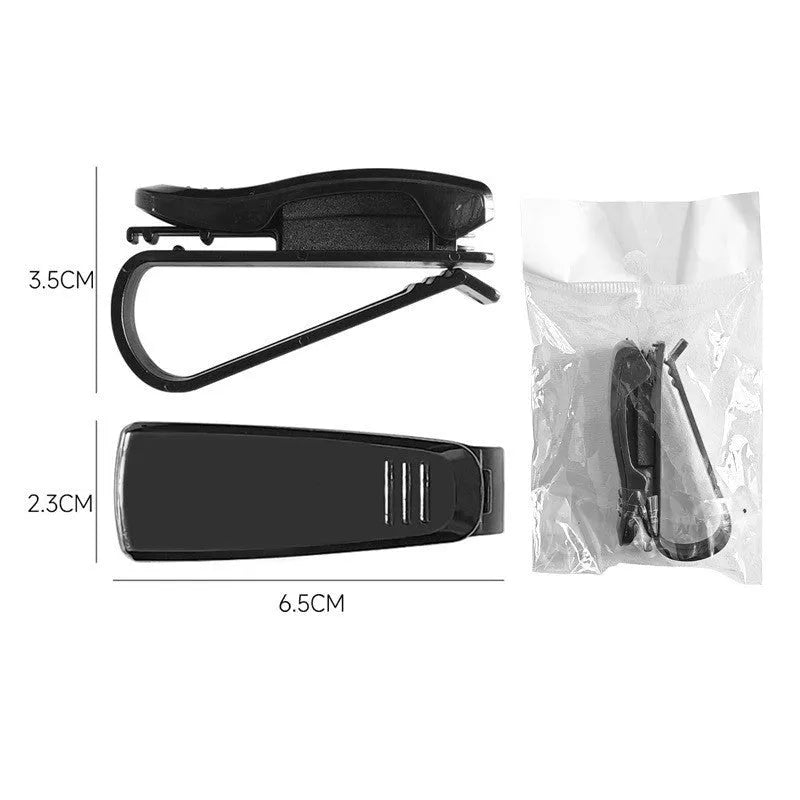 Black plastic car sun visor clip organiser for glasses and cards on a car interior.