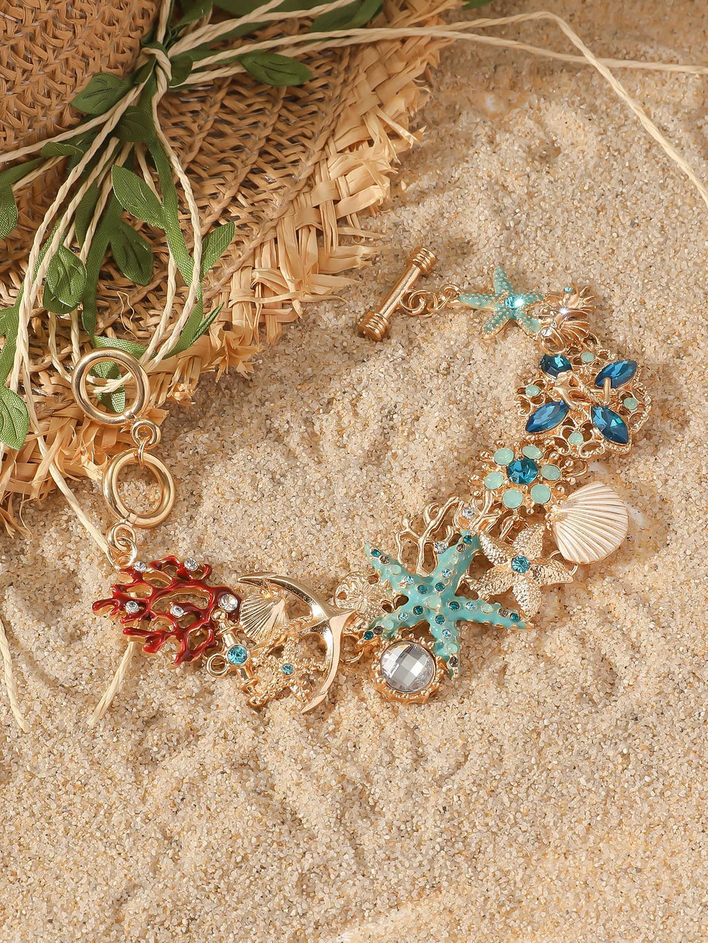 Women's alloy bracelet with boat anchor and rhinestone starfish design in turquoise, red, or blue.