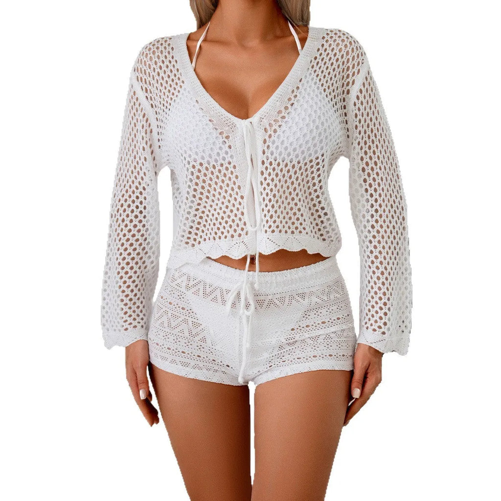 Women's apricot coloured hollow woven blouse with short length and bell sleeves on a hanger.