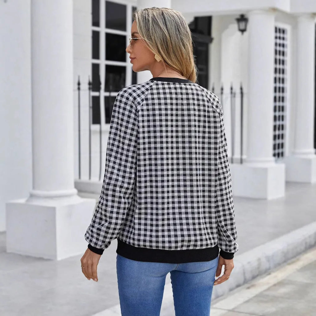 Black long sleeve pullover sweater with a Japanese sweet plaid and stripe pattern on a mannequin.