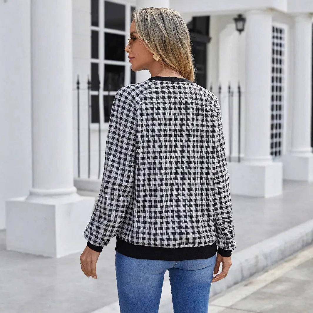 Black long sleeve pullover sweater with a Japanese sweet plaid and stripe pattern on a mannequin.