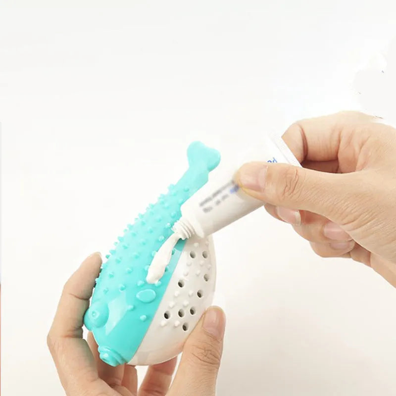 Blue silicone fish-shaped cat chew toy with a protruding grabbing handle on a white background.