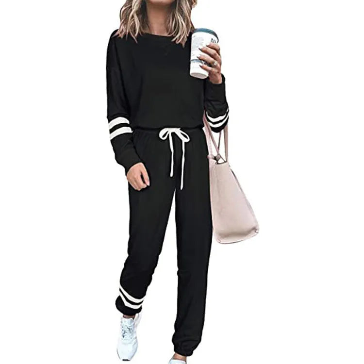 Plus size women's loose-fitting casual suit set in a solid colour, comprising a long-sleeved top and pants.