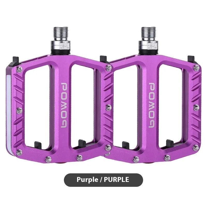 Pair of aluminium alloy bicycle pedals with integrated LED lights in a choice of colours.