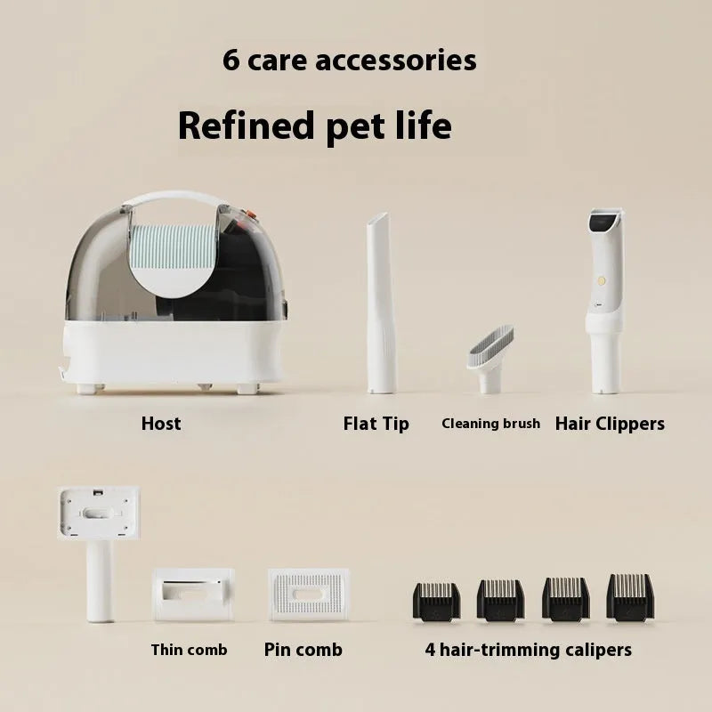 Pink and white pet grooming vacuum cleaner with electric shear and hose attachments on a white background