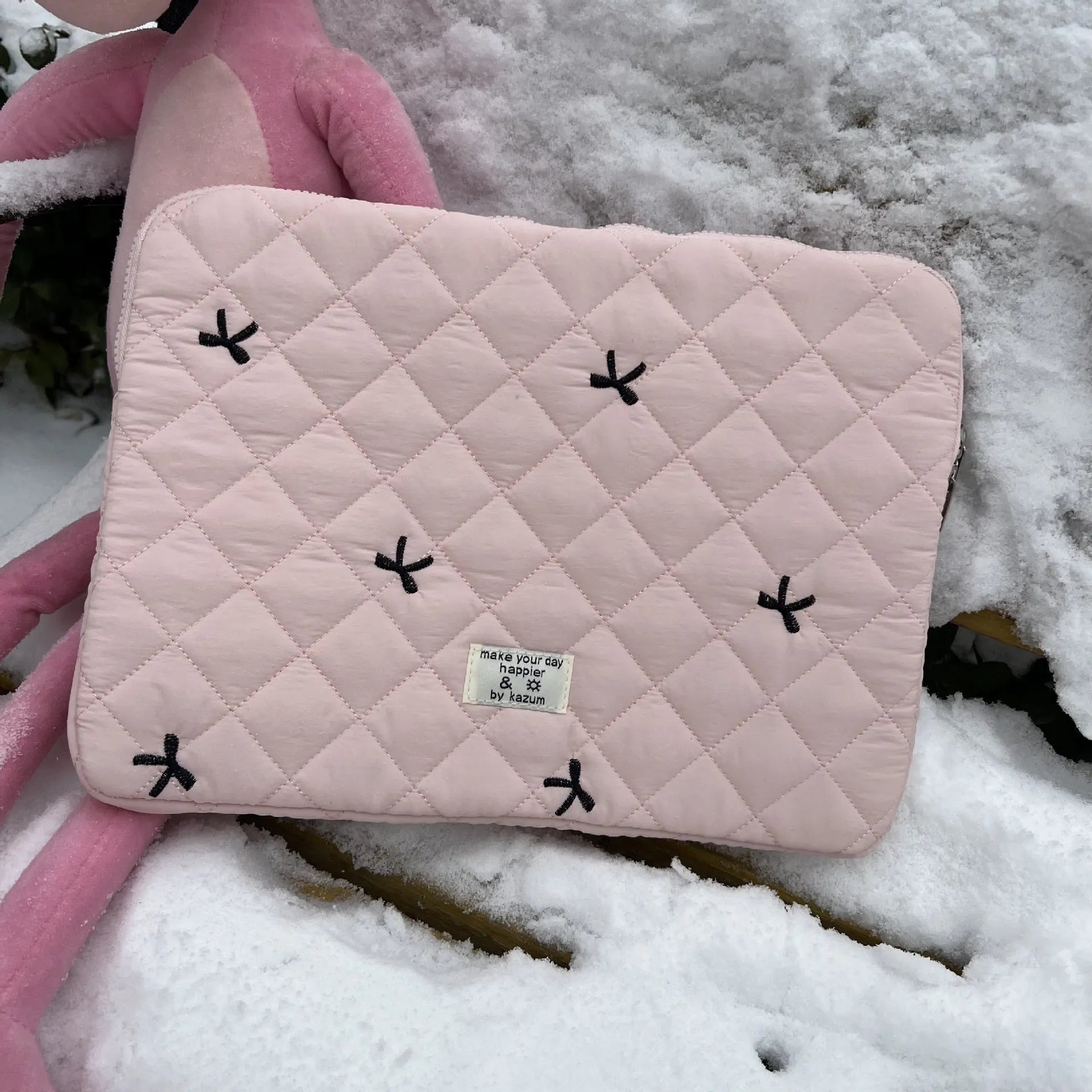 Laptop storage bag with rhombus embroidered bow decoration in nylon material showing colour options