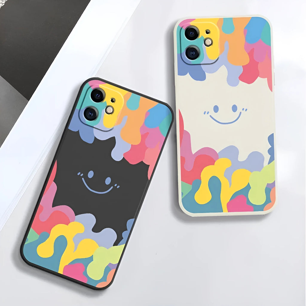 White TPU iPhone case with rainbow smiley faces on top and bottom, includes a black lanyard.