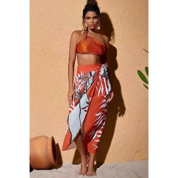 Women's high-waisted push-up swimsuit with brown chiffon dress cover-up showing split skirt design