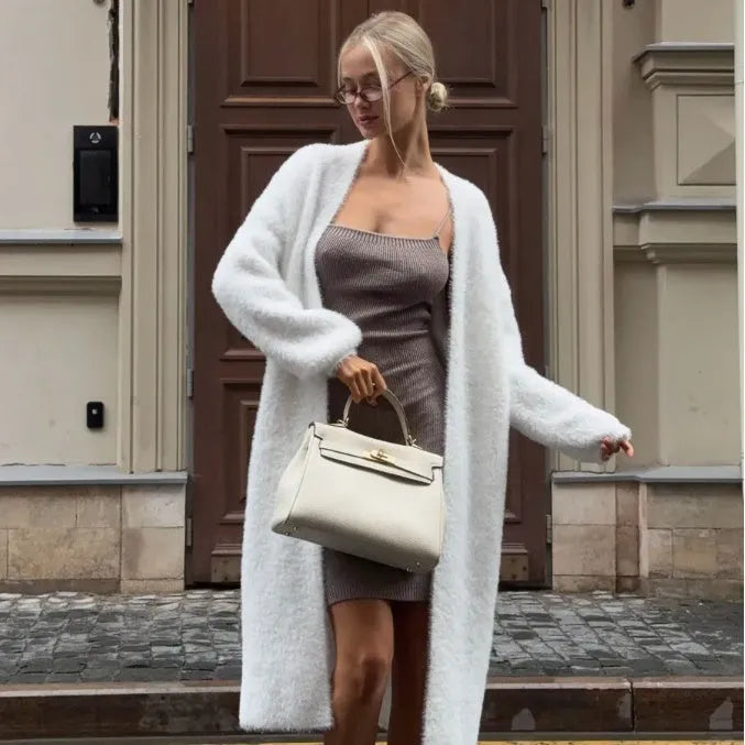 White polyester knit cardigan jacket with extended length and loose fit