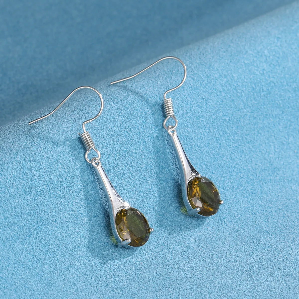 Olive green topaz colour drop earrings with water drop shape and electroplated finish
