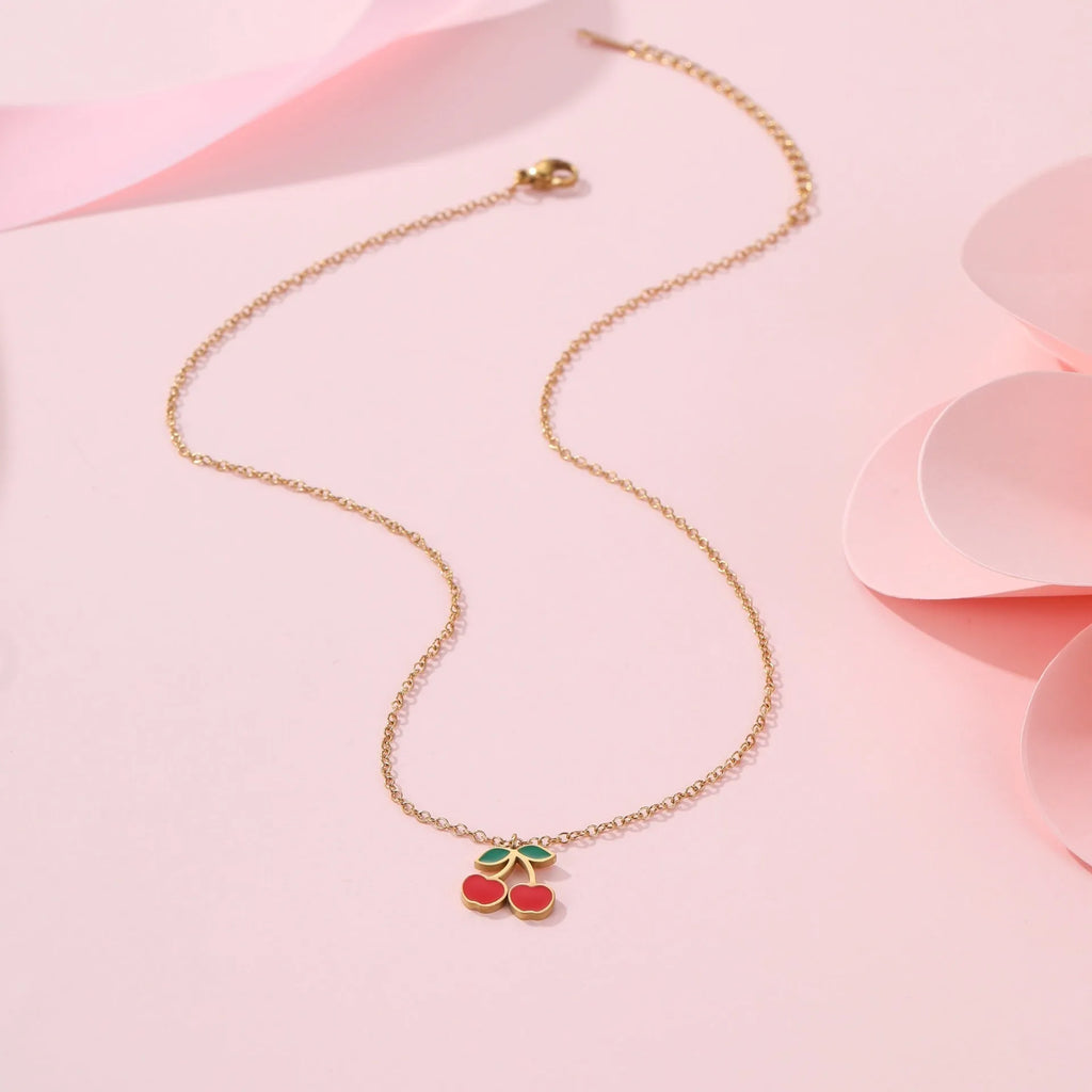 Four-piece cherry jewellery set with necklace, bracelet, earrings and ring in stainless steel with gold-toned finish