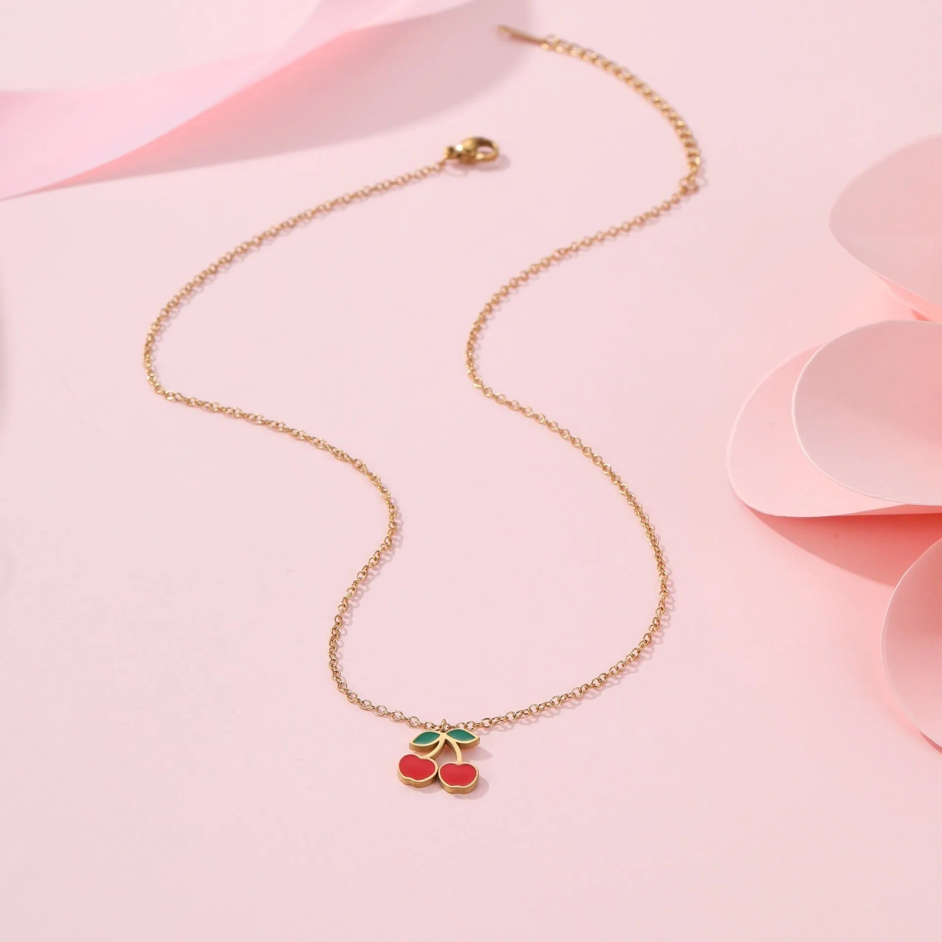 Four-piece cherry jewellery set with necklace, bracelet, earrings and ring in stainless steel with gold-toned finish