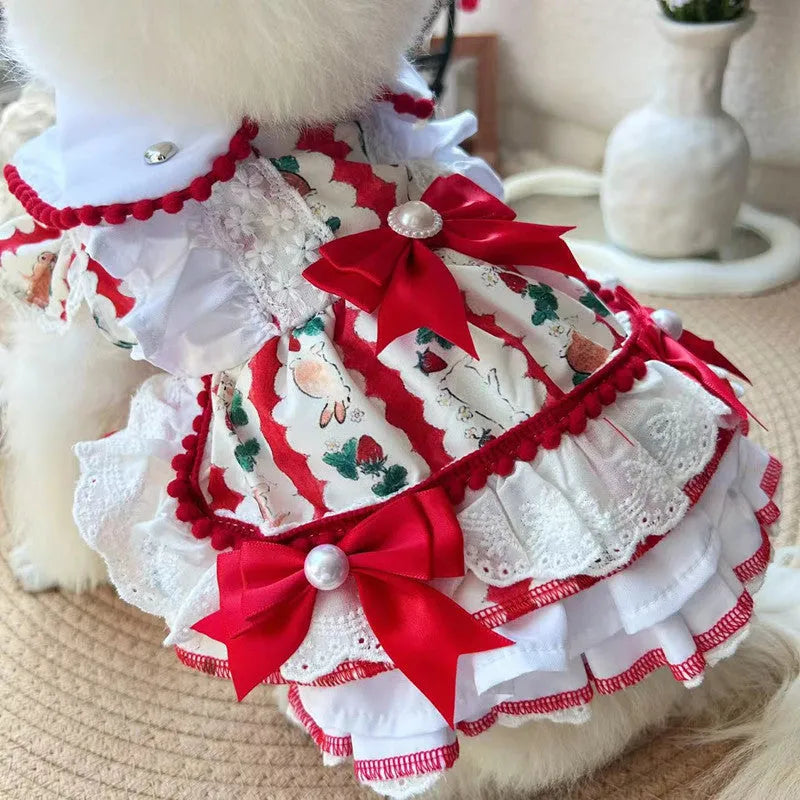 A small dog wearing a white polyester skirt with a rabbit motif, princess style.