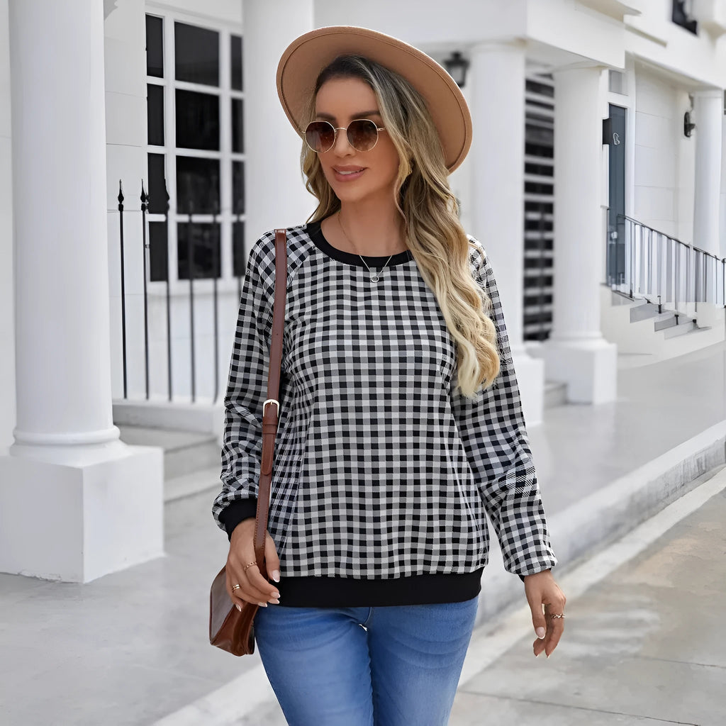 Black long sleeve pullover sweater with a Japanese sweet plaid and stripe pattern on a mannequin.