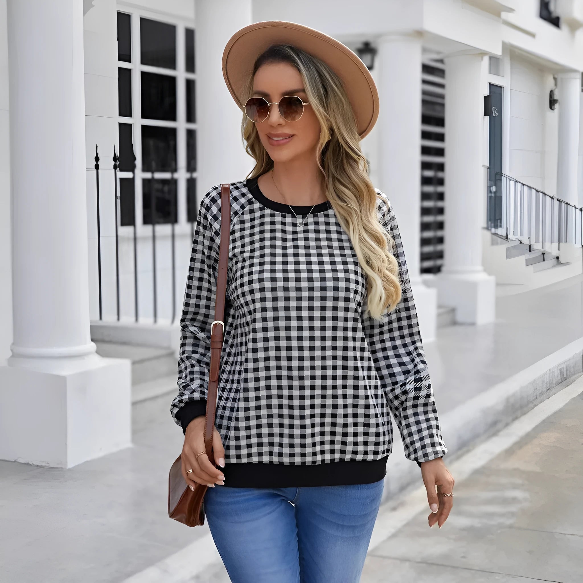 Black long sleeve pullover sweater with a Japanese sweet plaid and stripe pattern on a mannequin.
