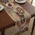 Dark blue Nordic Jacquard bouquet pattern table runner with tassel trim, 32cm wide.