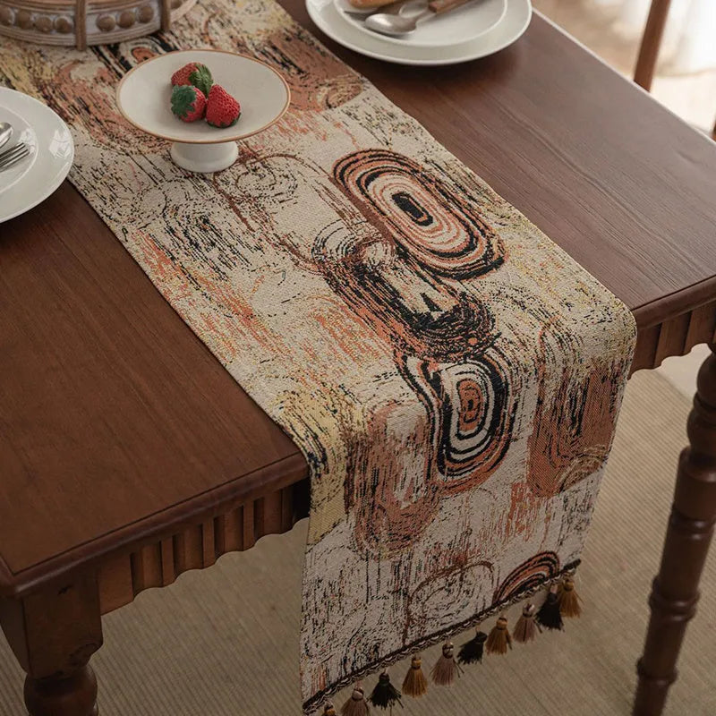 Dark blue Nordic Jacquard bouquet pattern table runner with tassel trim, 32cm wide.