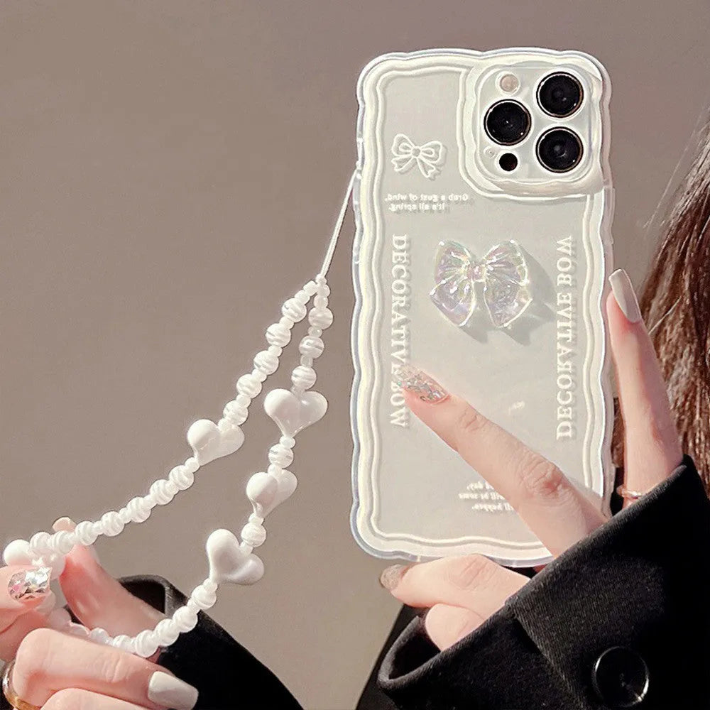 Transparent iPhone case with a three-dimensional ice-through bow decoration on the back.