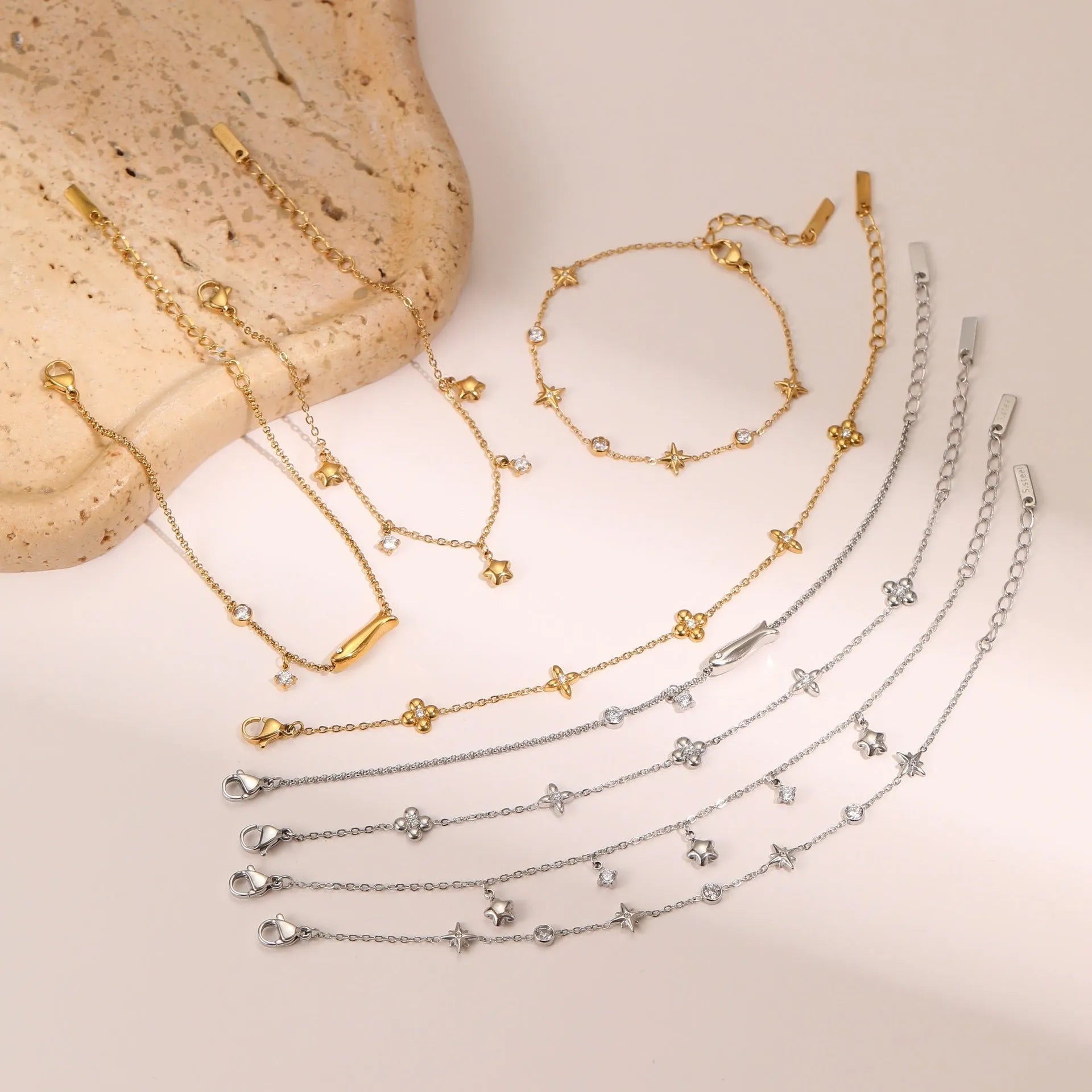 Gold-plated stainless steel bracelet with a hexagonal zircon star pendant for women.