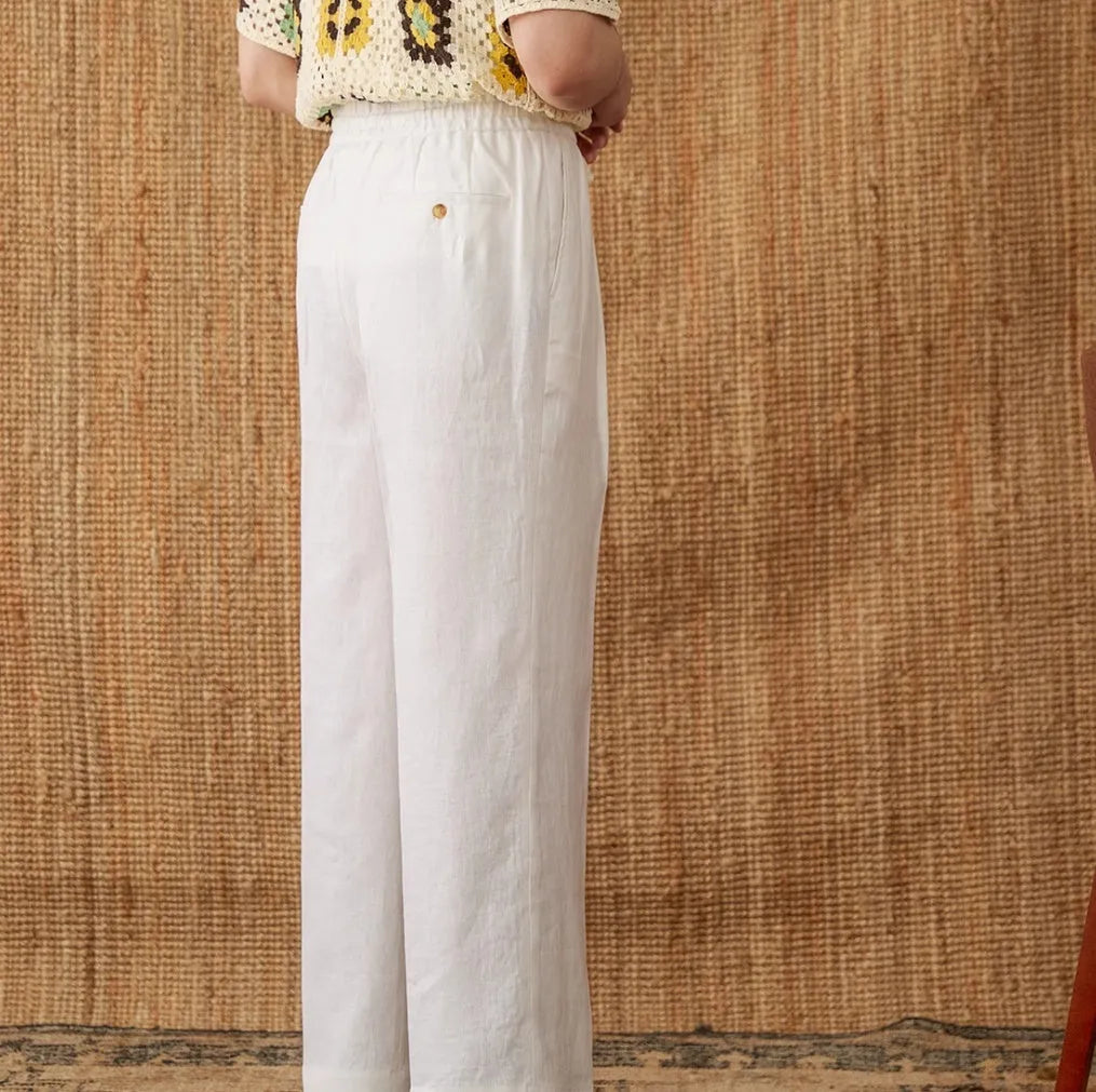 Women's linen trousers in high-waisted loose fit with elasticated waistband in navy blue colour