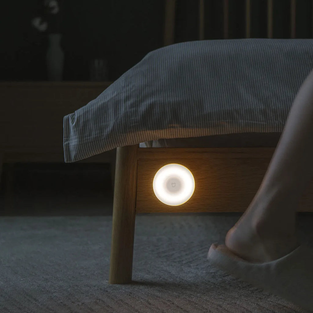 White square Mijia Night Light 2 Bluetooth bedside lamp with human body induction on wooden table