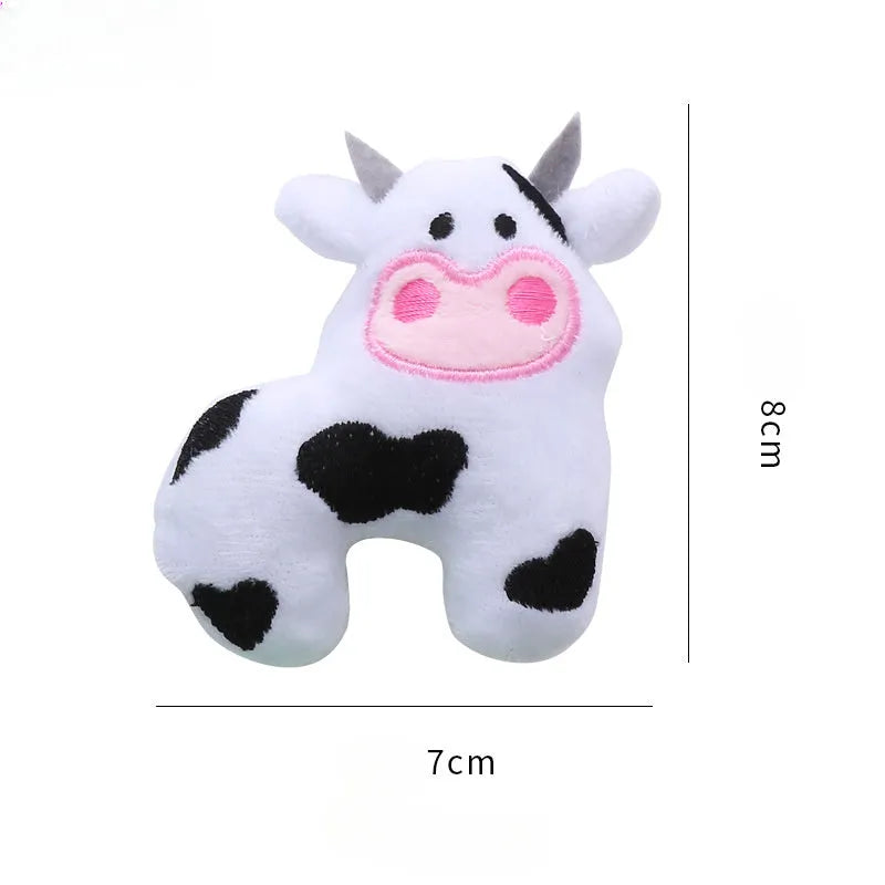 Plush parrot-shaped cat toy with catnip for interactive play next to cow and crocodile options.