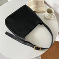 Soft black and brown PU leather ladies shoulder bags with swing thread decorative detail.