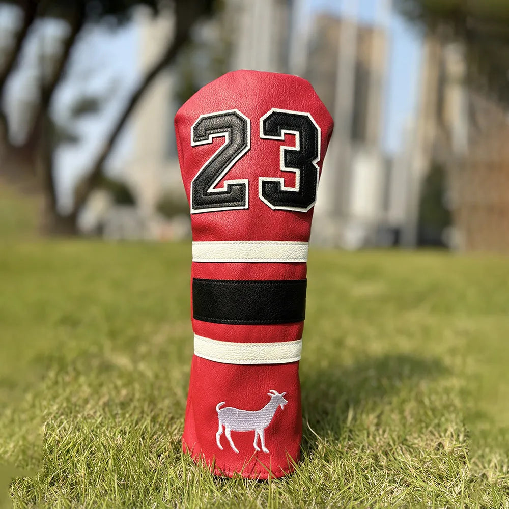 Red square putter iron head golf club sleeve covering a wooden pole set
