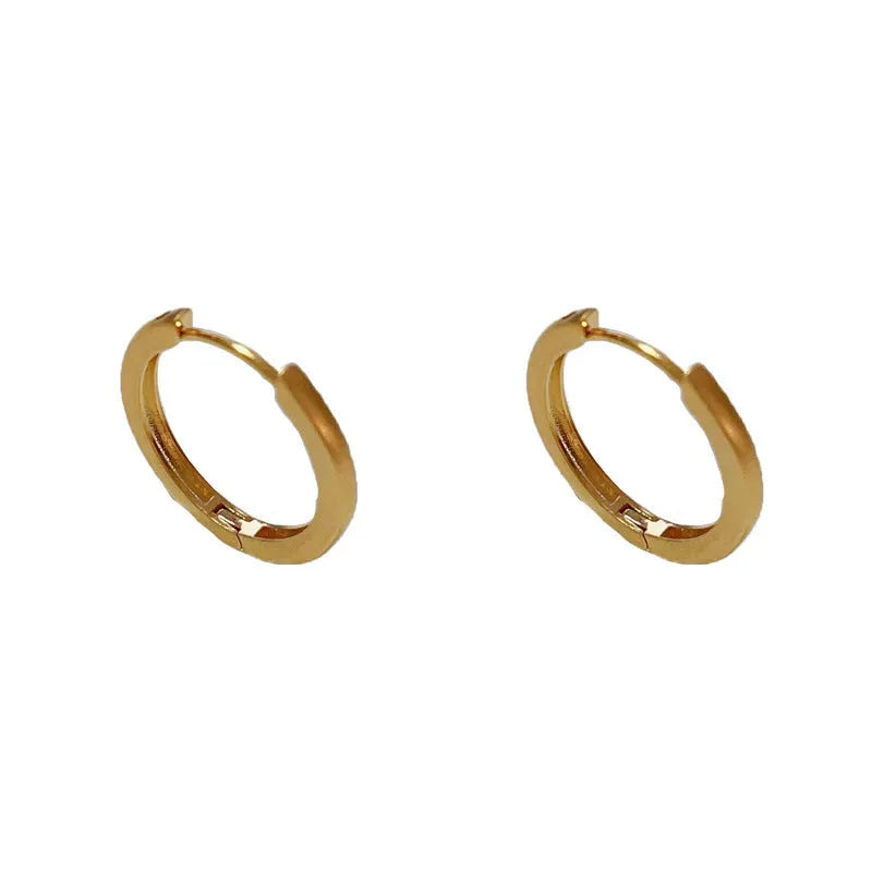 Geometric circle ear clip in gold finish with real gold plating on copper material
