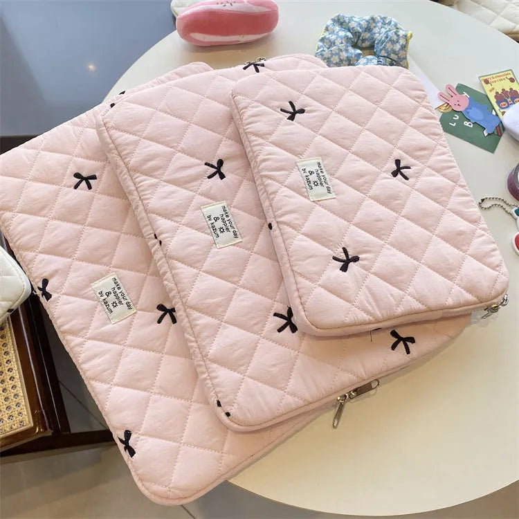 Laptop storage bag with rhombus embroidered bow decoration in nylon material showing colour options