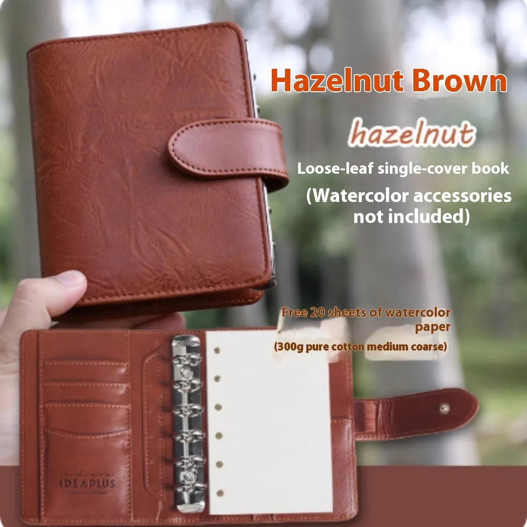 A7 loose-leaf watercolour notebook with twin-wire binding shown in avocado green colour