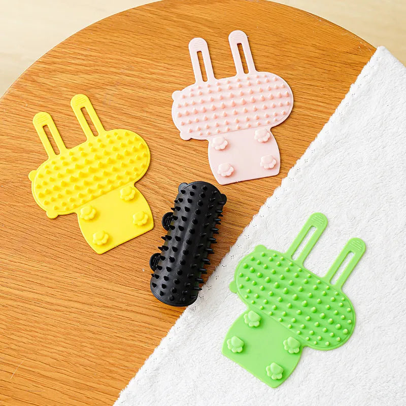 Silicone cat scratching massage comb with adjustable strap in one of four colours: black, green, pink, or yellow