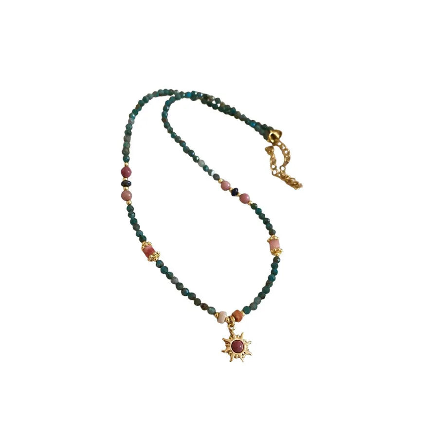 Freshwater pearl necklace with stone sun pendant on adjustable clavicle chain