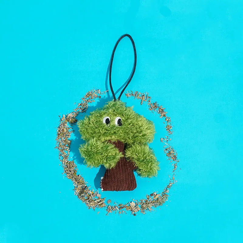 Pine tree shaped cat chew toy pendant that doubles as a tease stick.