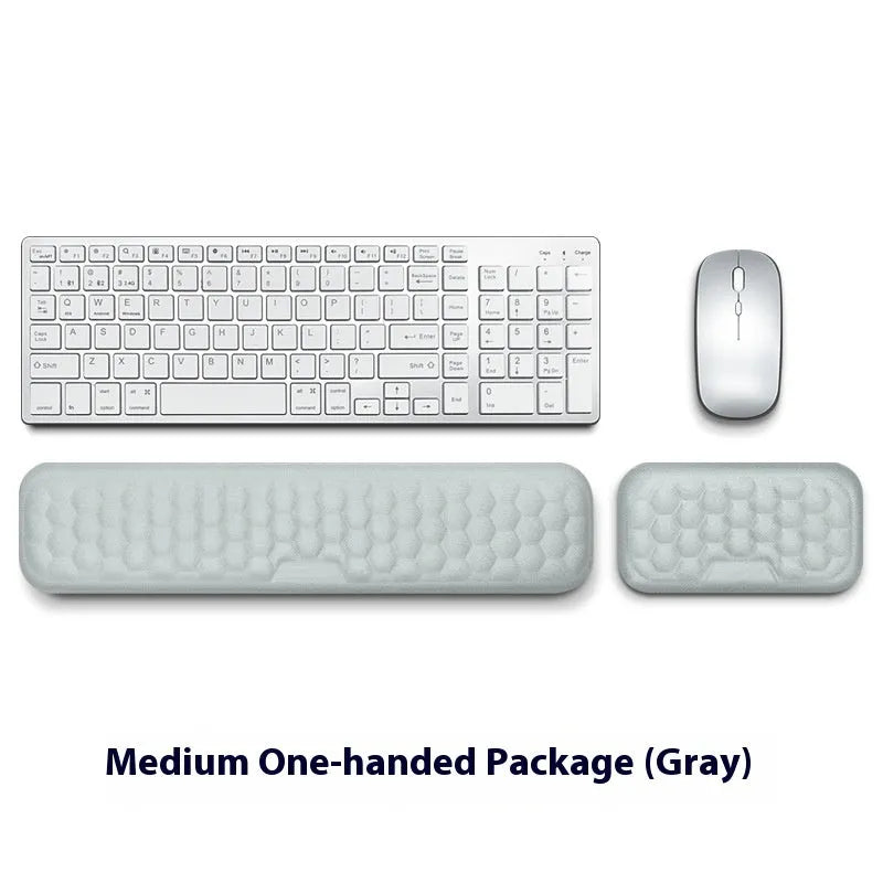 Black memory foam mouse wrist pad with silicone bottom on a wooden desk