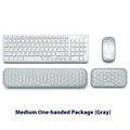 Black memory foam mouse wrist pad with silicone bottom on a wooden desk