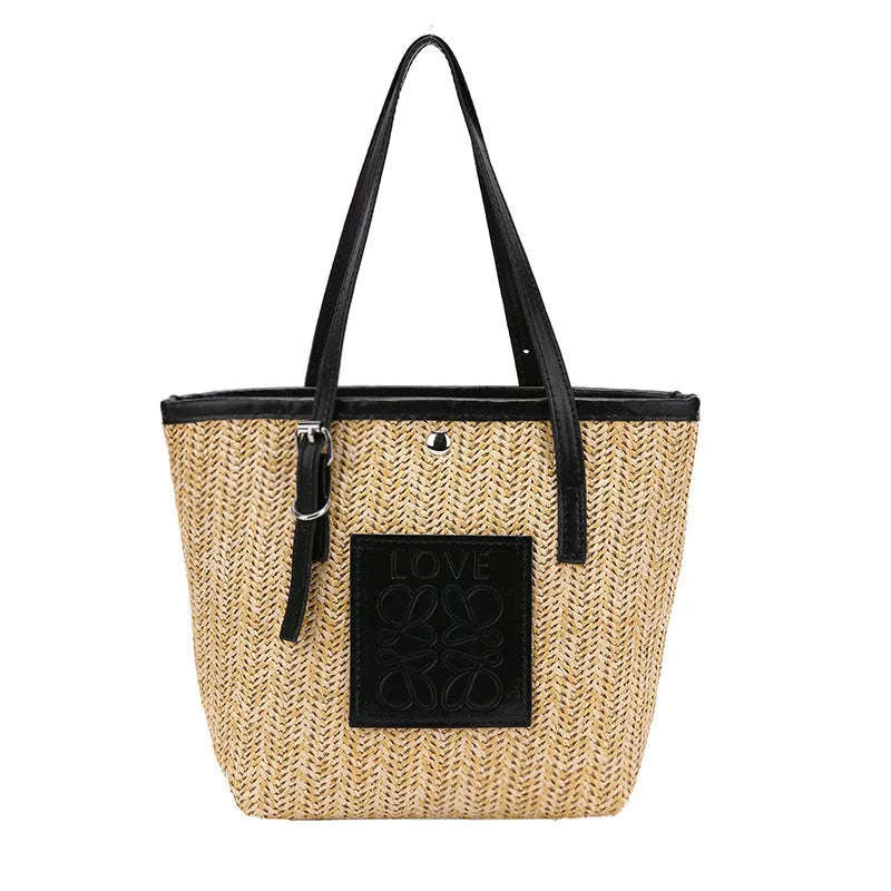 Straw woven women's shoulder bag with 27cm width showing three-dimensional pocket and 18cm handle