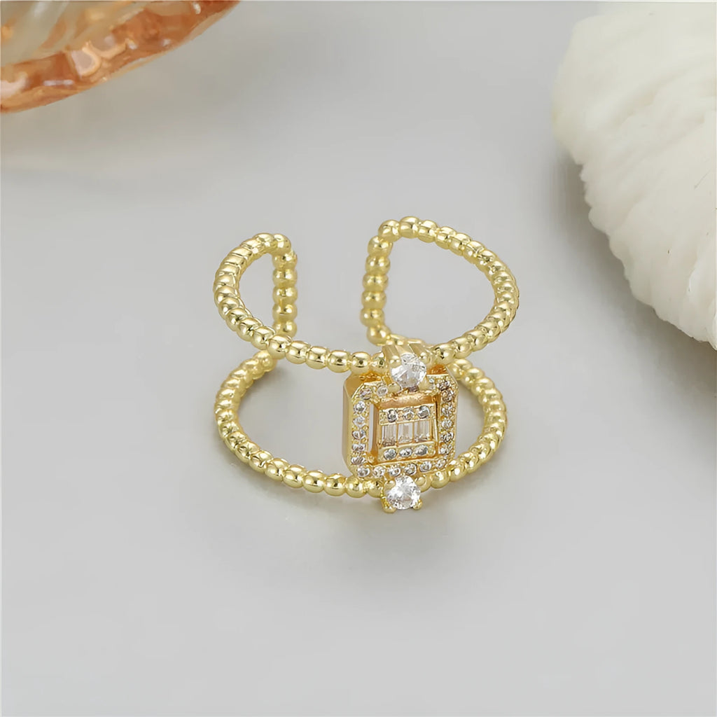 Copper open ring with adjustable opening and asymmetric U-shaped design in gold tone