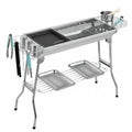 Large stainless steel portable flip barbecue oven with charcoal grill and cooking nets.