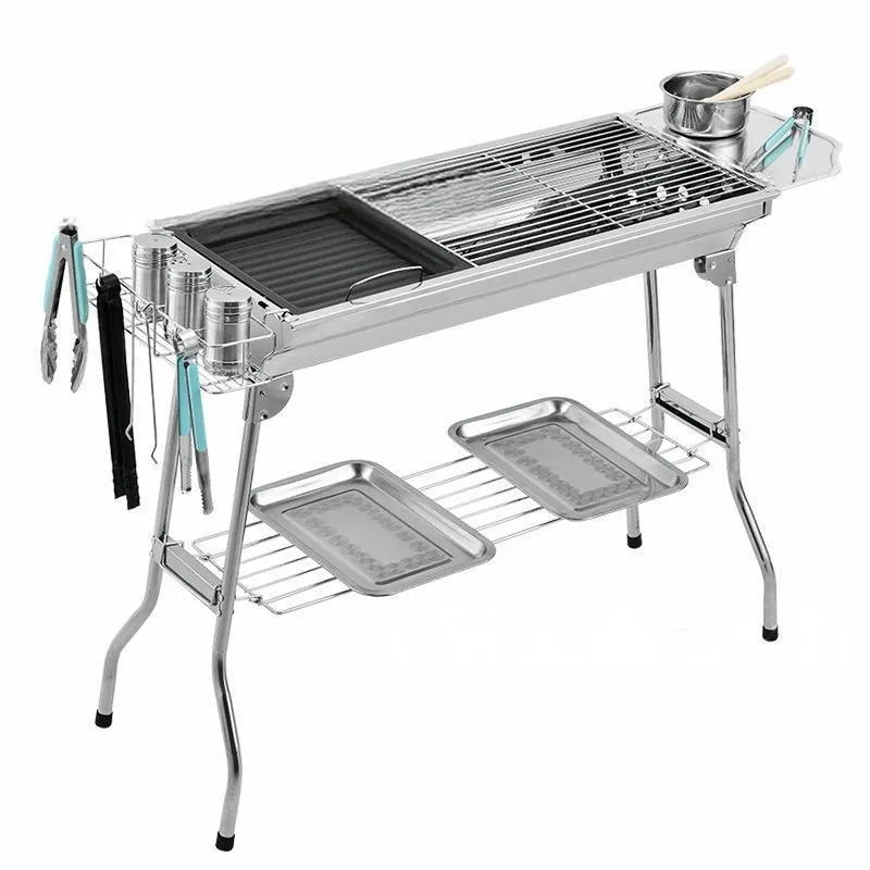 Large stainless steel portable flip barbecue oven with charcoal grill and cooking nets.