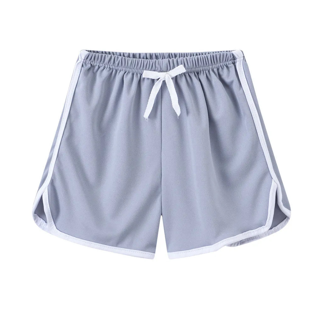Children's polyester beach shorts in various colors and patterns including pineapple and kitten designs for sizes 100 to 140